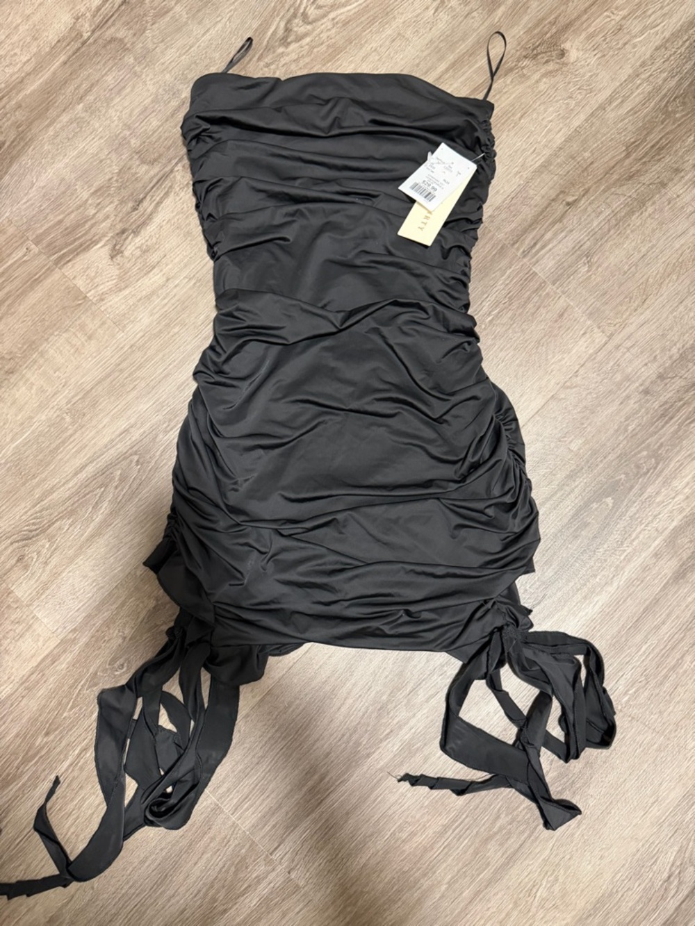 black ruched tie-hem mini dress